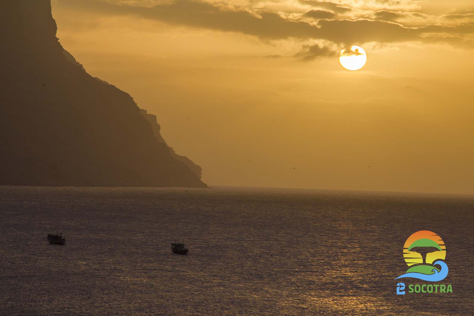 Sunset landscape Qulensya قلنسية Qulansiya or Qalansiyah or Qalansia sea mountain clouds boats Socotra Island